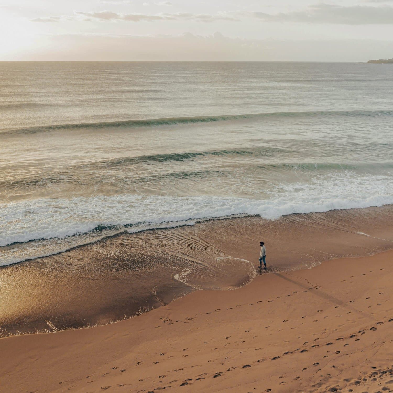 Person walking along a Hunter coast beach